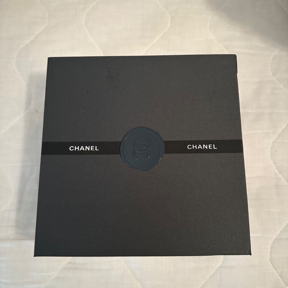CHANEL BLACK AND SILVER GIFT BOX WITH LOGO SEAL AND AFFIXED RIBBON-
